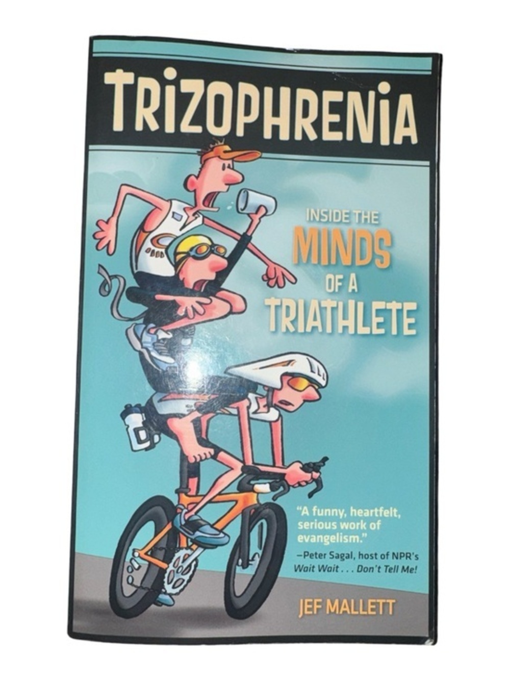 Trizophrenia: Inside the Minds of a Triathlete Light Teal Cover by Jef Mallett